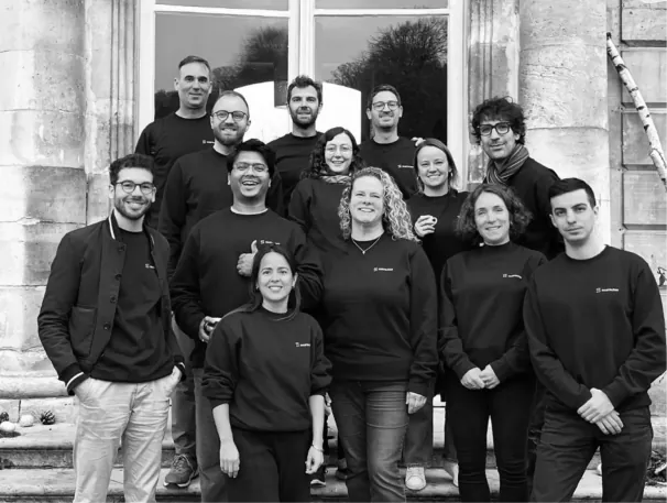 The Searoutes team gathered on the steps outside their office