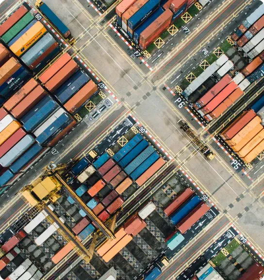 Aerial top-down view of a container terminal with stacked containers