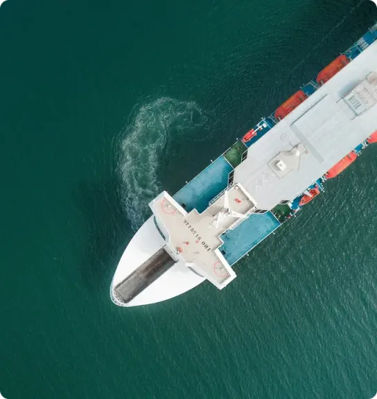 Aerial top-down view of a container ship underway at sea