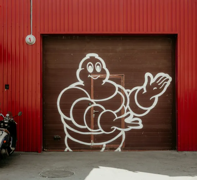 Michelin mural on a red factory wall